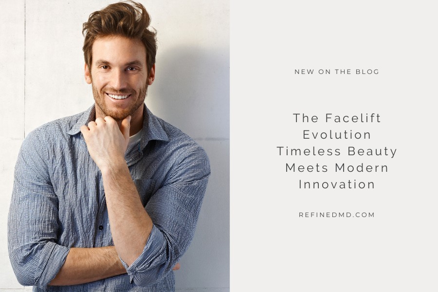 man in blue shirt smiling with his fist on chin (model)
