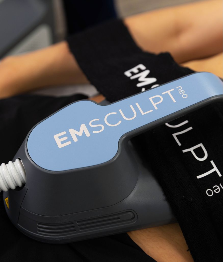Close-up of EMSCULPT neo applicator on patient's abdomen